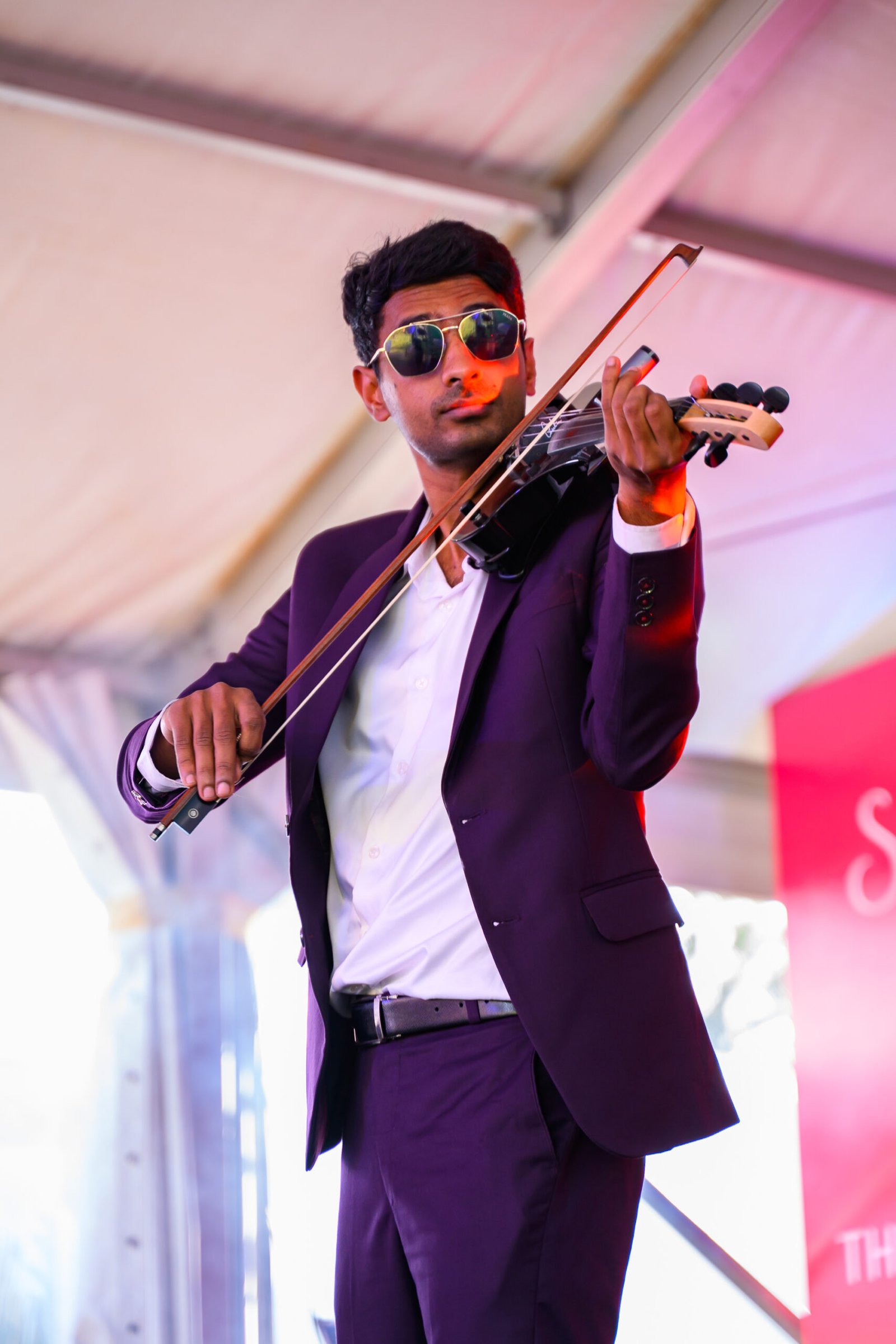 Violinist performing during an indoor event