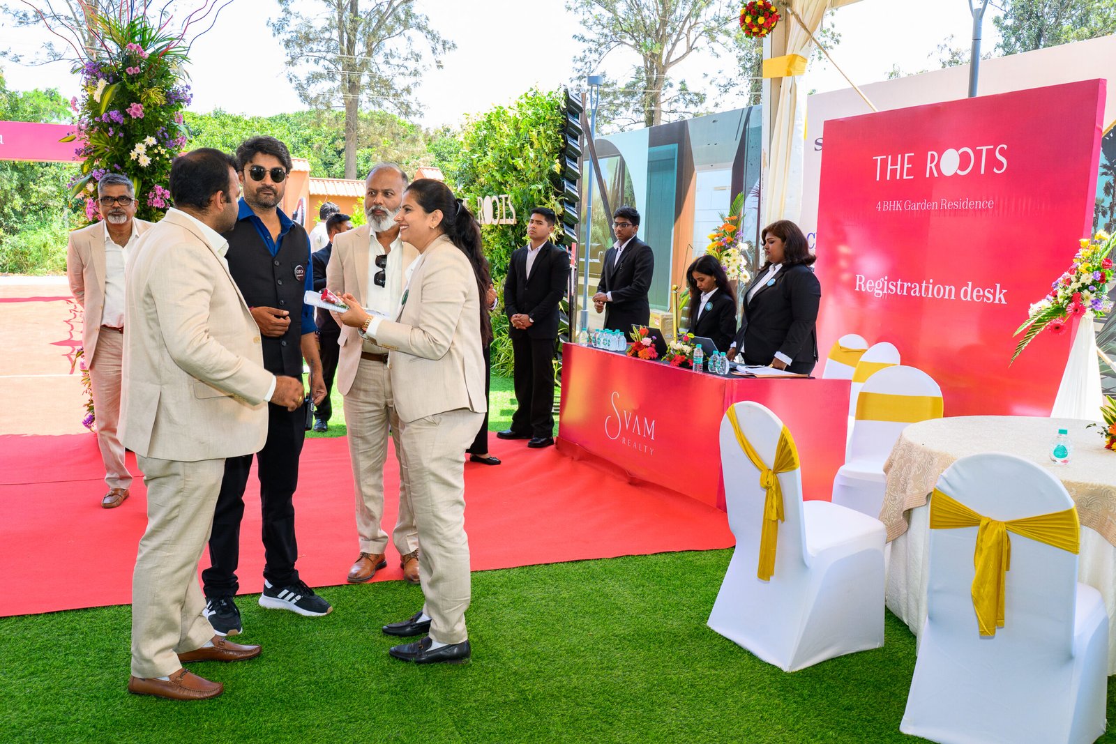 Guests being welcomed at an outdoor reception desk