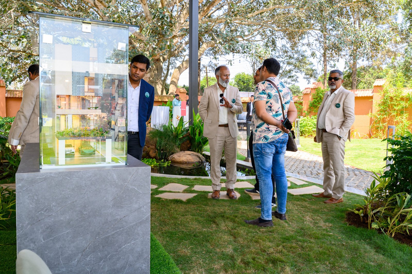 Guests viewing an architectural model during a property launch