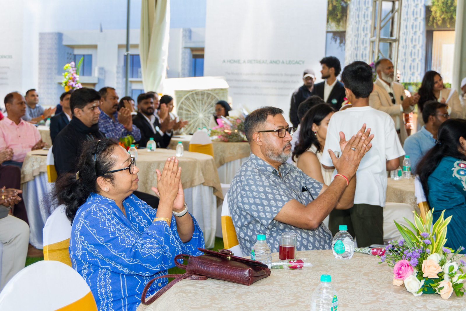 Seated audience applauding at a business event