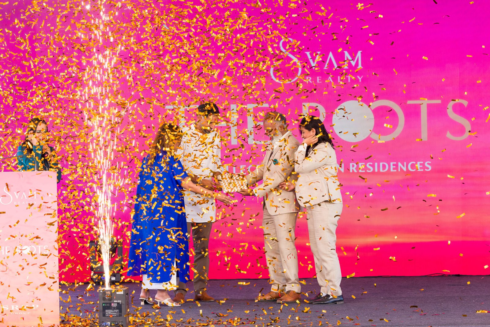 Stage celebration with confetti at a launch event