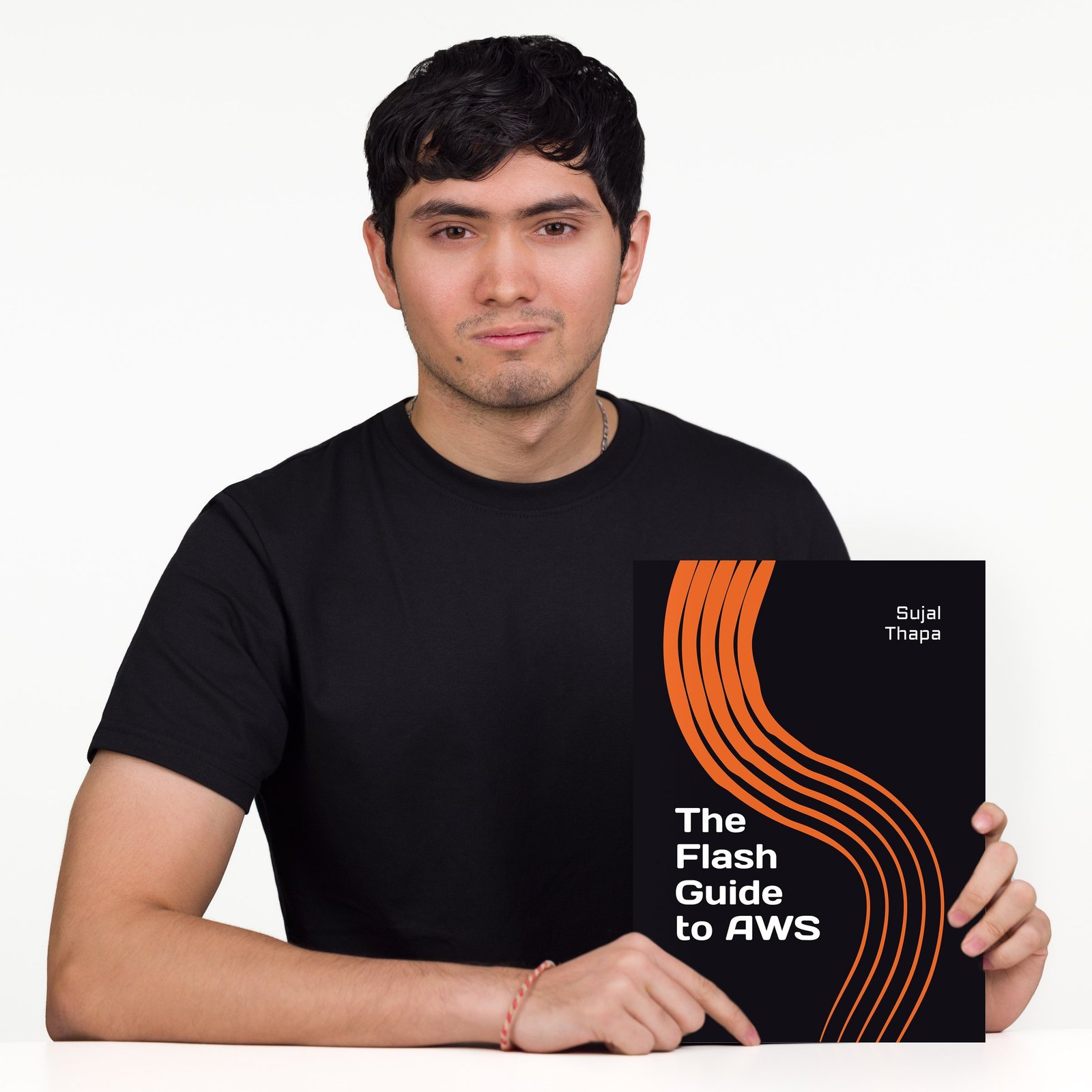 Author holding a book during a studio portrait session