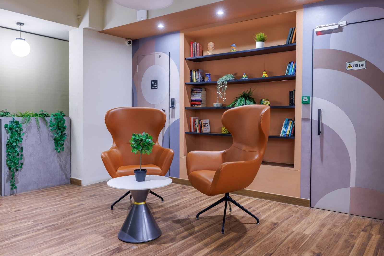 Modern reception area with an armchair and shelving